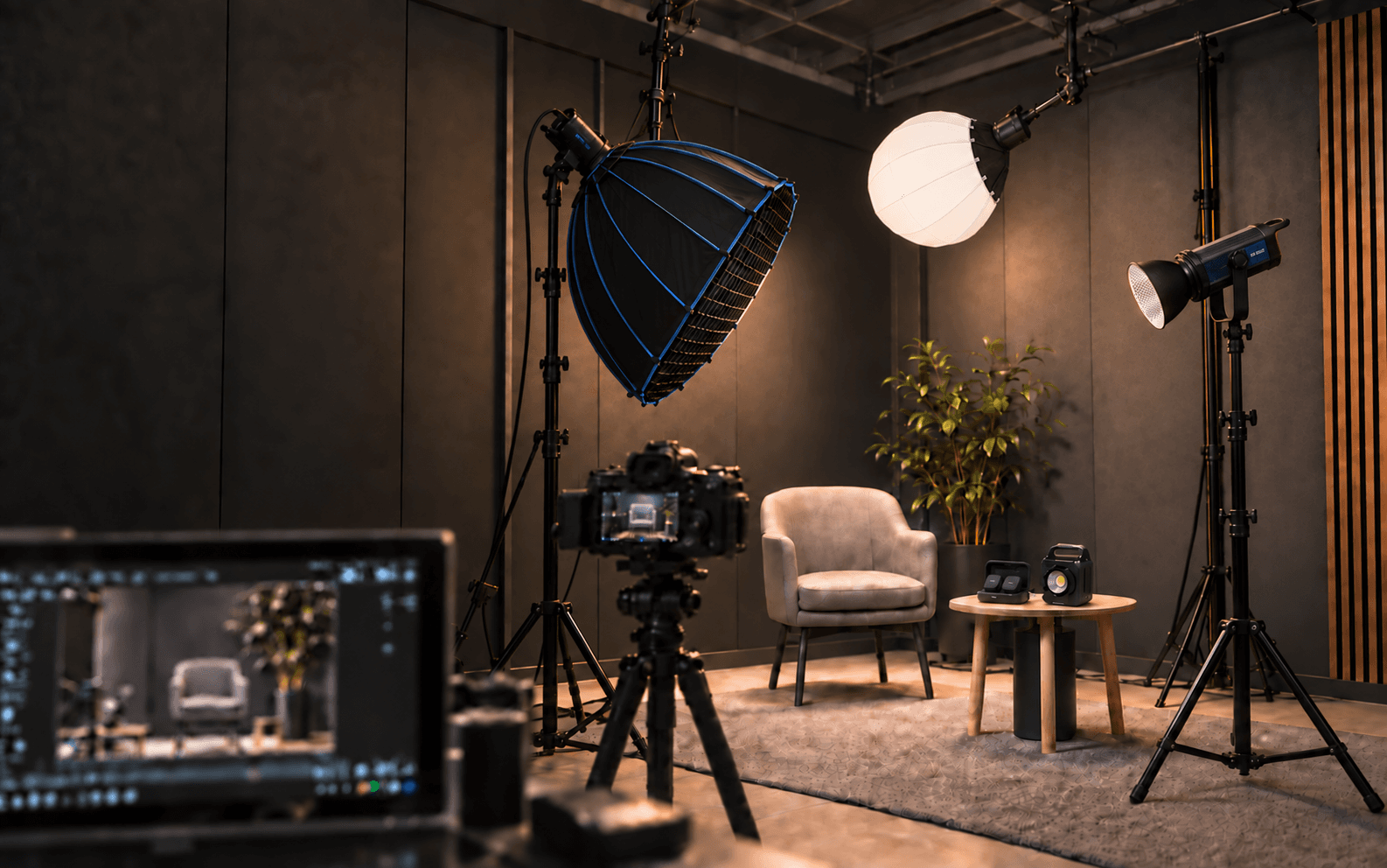 Photographic studio with lighting, camera, filming chair and a wireless microphone and a 200W portable light on the table